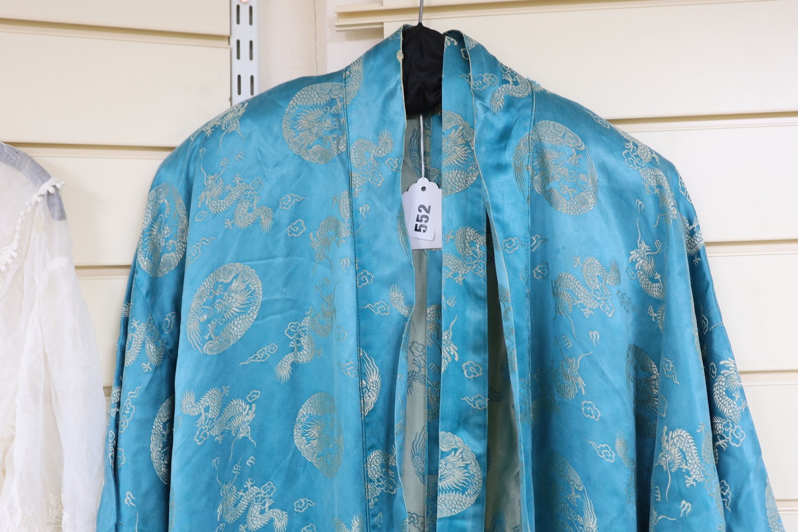 A 20th century Chinese blue brocade embroidered kimono with dragons
